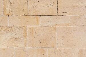 Gray and beige stone wall background photo