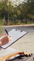 Girl Writes Notes On A Sheet Music To Play Them With The Ukulele video