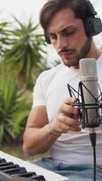 Singer Author Sets Up The Microphone And Sings Playing The Keyboard video