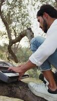 Boy Plays The Musical Keyboard On The Trunk Of A Tree video