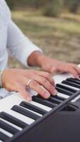 Smiling Boy Play The Musical Keyboard Crossing In Rhythm In The Countryside video