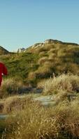 Astronaut Runs Toward An Uninhabited Land On A Hill To Ask For Help video