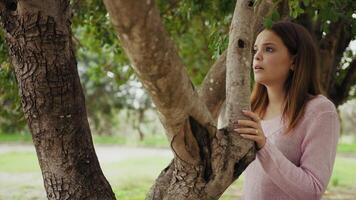 Scared Girl Tries To Hide Behind A Tree Before Being Caught By The Criminal video