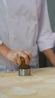 Chef Cutting Dough Circles for Dumpling Preparation video