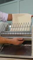 Chef Feeding Dough into Dough Rolling Machine video