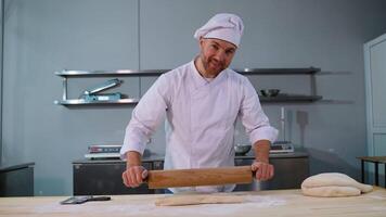 Chef Rolling Dough with Focus in Kitchen video