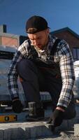 Worker Installing Interlocking Paving Stones video