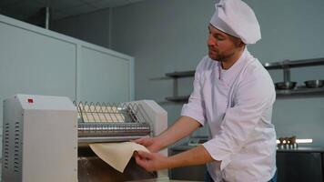 Chef Operating Dough Rolling Machine video