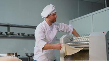 Chef Handling Dough with Sheeter Machine video