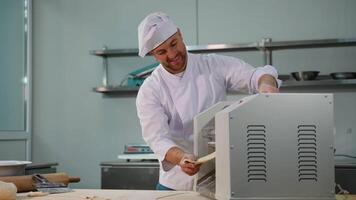 Smiling Chef Working with Dough Sheeter Machine video
