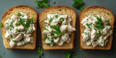 Delicious chicken salad served on whole grain bread with fresh parsley garnish photo