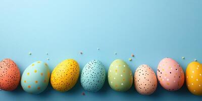 Colorful decorative Easter eggs arranged creatively on a blue background for festive celebration photo