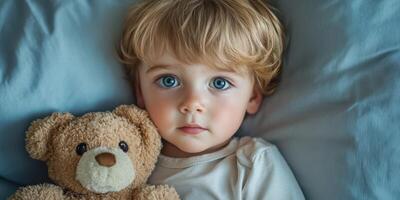 Sweet child cuddling teddy bear on soft bedding in a cozy bedroom atmosphere during a peaceful afternoon photo