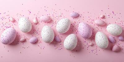 Colorful decorated eggs and mini candy on a pink background for Easter celebrations photo