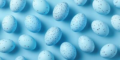 Colorful blue speckled eggs arranged on a light blue background for spring celebrations or artistic displays photo