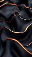 Elegant black fabric with flowing waves and striking orange trim capturing light in a soft atmosphere photo