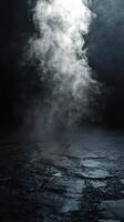 Mysterious swirling fog rises from a dark surface in a dimly lit environment during nighttime photo