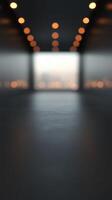 Softly glowing lights illuminate an empty modern space, highlighting its sleek lines and tranquil atmosphere during early evening hours photo
