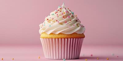 Delicious cupcake topped with creamy frosting and colorful sprinkles on a pastel pink background photo