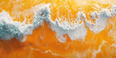 Vibrant ocean waves crashing onto a golden shore under bright sunlight in a tropical paradise photo