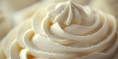 Frosted dessert with creamy swirls displayed on a white background at a bakery counter photo