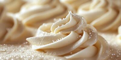 Creamy white frosting swirls on dessert topped with sparkling sugar on a light background photo