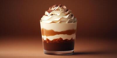 Delicious chocolate dessert layered with cream and cocoa served in a glass photo