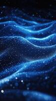 Blue shimmering waves of light create a mesmerizing pattern in a dark environment, evoking a sense of depth and tranquility photo