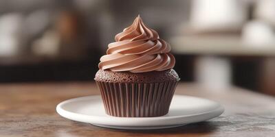 Delicious chocolate cupcake with swirled frosting on a white plate in a cozy bakery photo