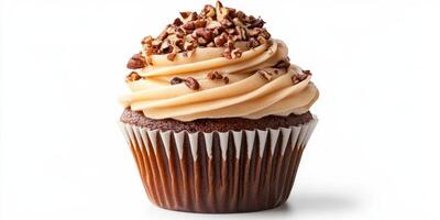 Chocolate cupcake topped with creamy frosting and crushed nuts on a plain background photo
