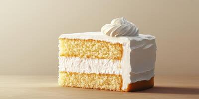 Moist vanilla cake slice topped with fluffy whipped cream on a wooden table photo