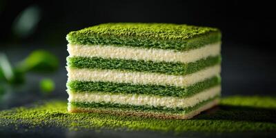 Delicious layered matcha cake with vibrant green tea flavor served on a dark background photo
