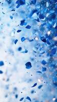 Confetti shower in vibrant blue creating a festive atmosphere during a celebration photo