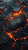 Magmatic cracks reveal glowing lava beneath the surface in a volcanic landscape at dusk photo