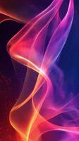 Colorful abstract waves of light flowing gracefully in a dark background photo