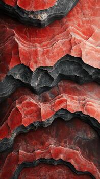 Layers of red and black rock formations showing natural beauty and geological patterns in a dramatic abstract style photo