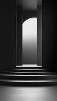 Minimalist architectural design featuring stairway and arched doorway illuminated in monochrome tones photo