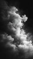 Mysterious swirling clouds create a captivating display of light and shadow in a darkened atmosphere photo