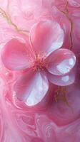 Beautiful pink cherry blossom with glossy petals atop abstract pink background featuring gold accents photo