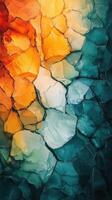 Colorful cracked surface depicting vibrant abstract patterns in various hues during daylight photo