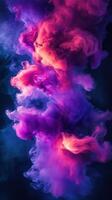 Vibrant colors swirl together in a captivating display of purple and orange hues in a dark background photo
