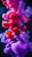 Colorful swirling smoke creates mesmerizing patterns in dark background at night photo