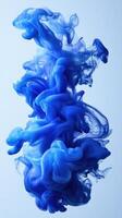 Swirling blue ink creates mesmerizing patterns in water, showcasing the beauty of fluid motion photo