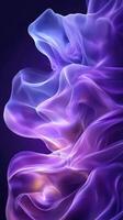 Ethereal purple waves of translucent fabric create a mesmerizing visual effect in a darkened space during the evening photo