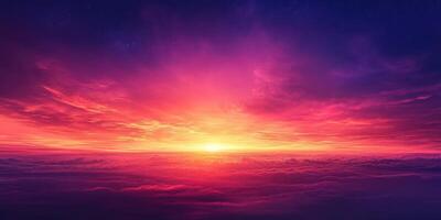 Vibrant sunset colors illuminate the sky over clouds at dusk with shades of pink, purple, and orange blending seamlessly photo