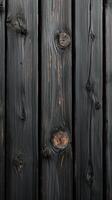 Dark wooden planks create a striking texture in a rustic setting with natural grain patterns and knots photo