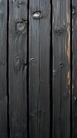 Dark wooden planks with textured surface capture attention in a rustic setting photo