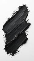 Black paint stroke on a white background showcasing artistic texture and movement in modern abstract art photo