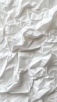 Crumpled white paper texture with various folds and wrinkles in natural light photo