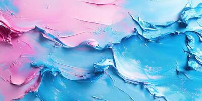 Vibrant abstract artwork featuring swirling pink and blue paint textures created with thick brushstrokes photo